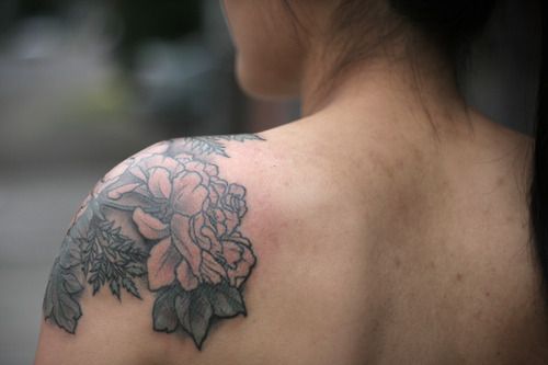 Cool Black And Grey Peony Flowers Tattoo On Girl Left Shoulder