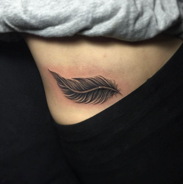 Cool Black Ink Feather Tattoo On Right Hip
