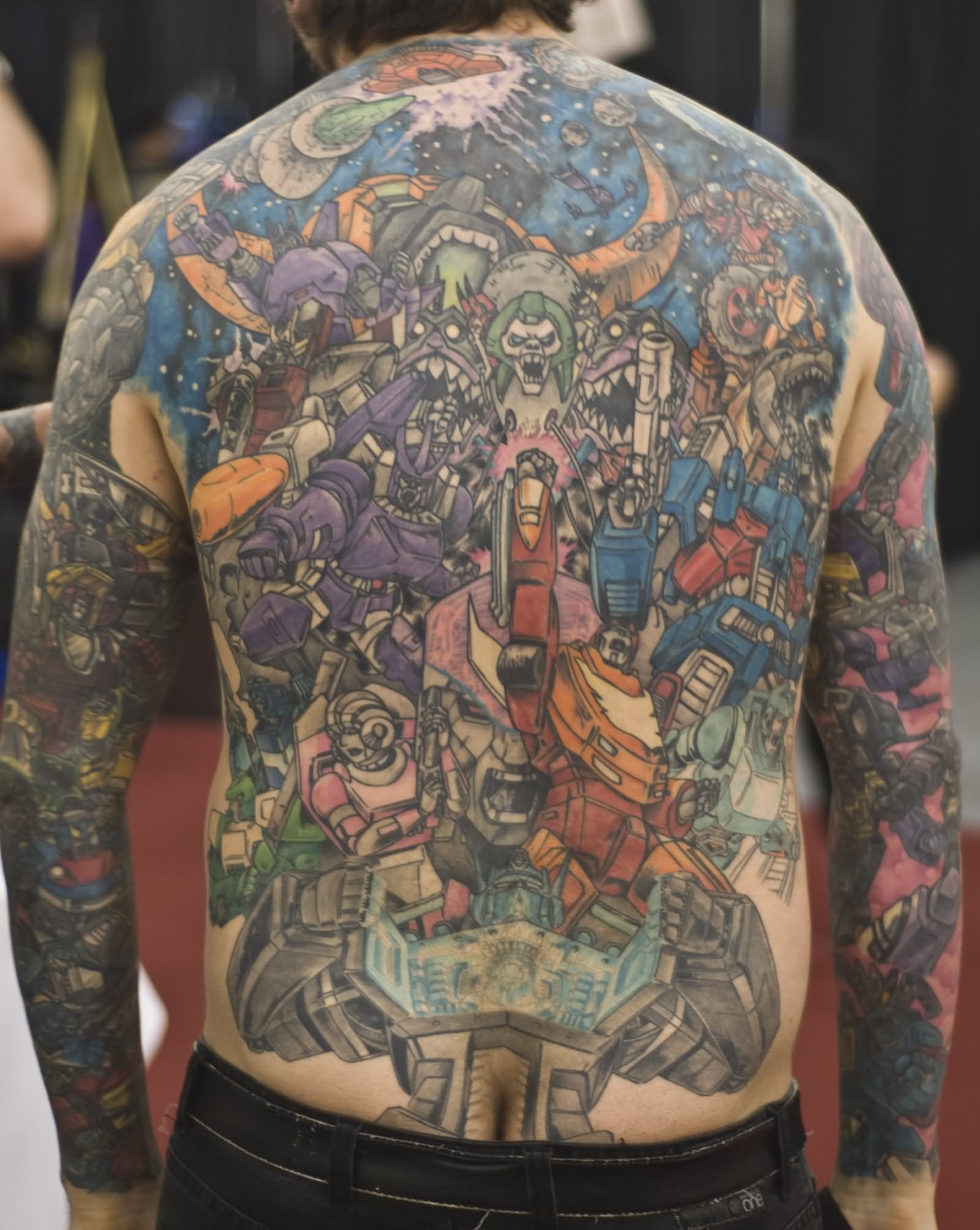 Cool Colorful Transformer Tattoo On Man Full Back