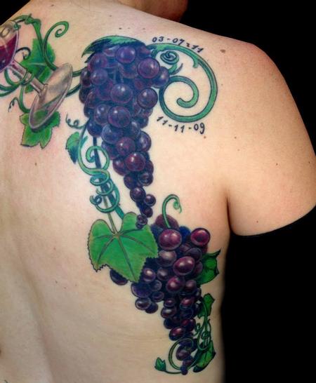 Cool Grapes With Wine Glass Tattoo On Man Upper Back