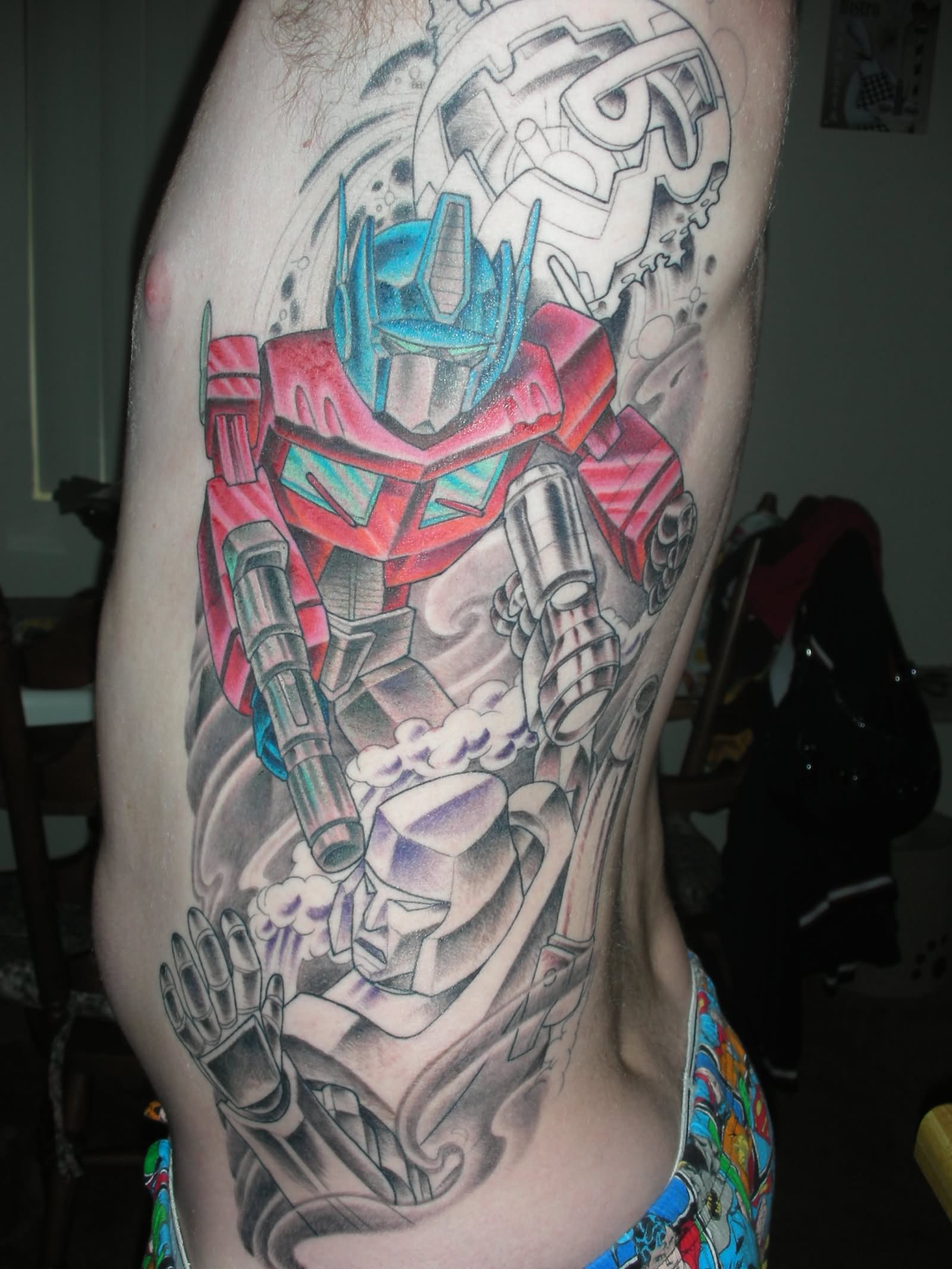 Cool Transformer Tattoo On Man Side Rib