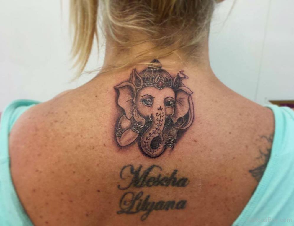 Cute Ganesha Head Tattoo On Girl Upper Back