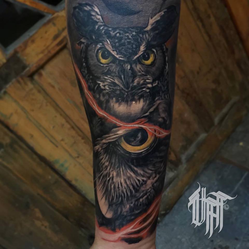 Dark Ink Yellow Eyes Owl Tattoo On Arm Sleeve
