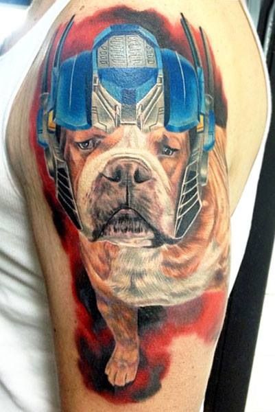 Dog With Transformers Helmet Tattoo On Left Shoulder