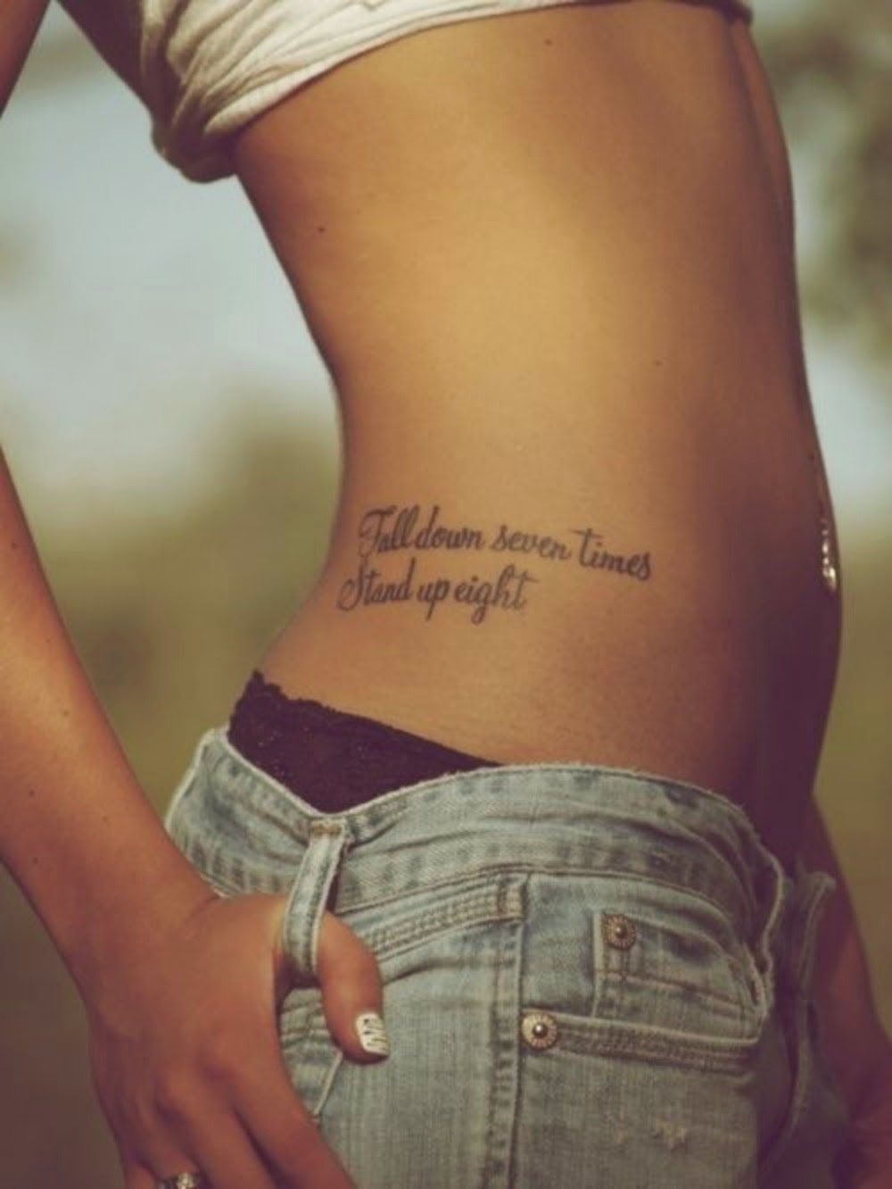 Fall Down Seven Times Stand Up Eight Words Tattoo On Girl Right Hip