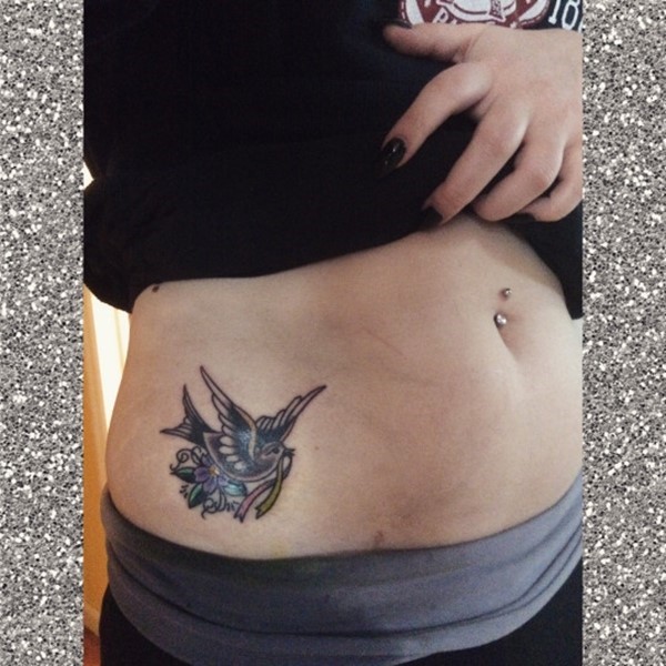 Flying Bird With Flower Tattoo On Girl Right Hip