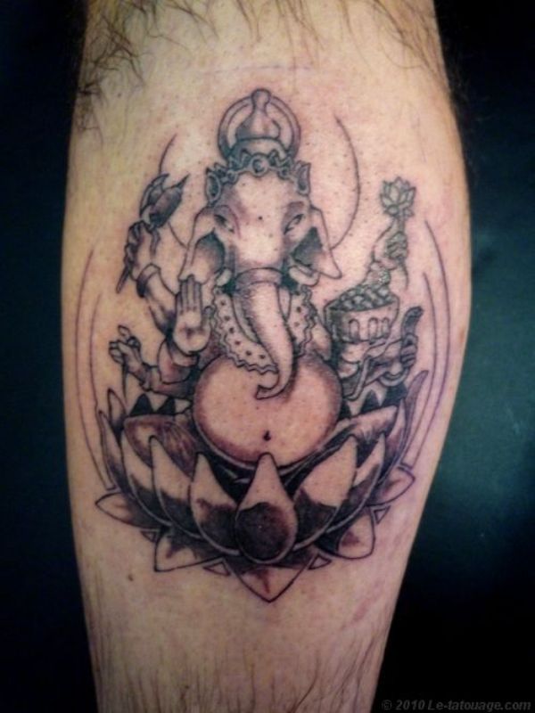 Ganesha In Grey Lotus Tattoo On Back Leg