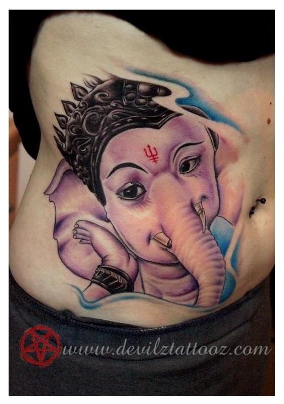 Ganesha Head Tattoo On Stomach