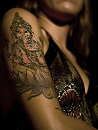 Ganesha On Lotus Tattoo On Girl Right Half Sleeve