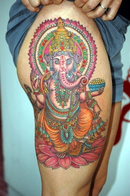 Ganesha On Lotus Tattoo On Side Thigh