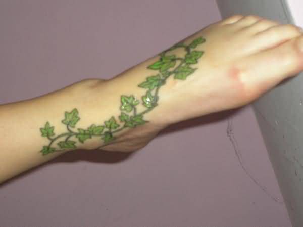 Green Ink Poison Ivy Plant Tattoo On Left Foot