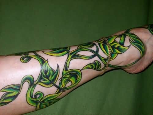 Green Ink Poison Ivy Plant Tattoo On Leg