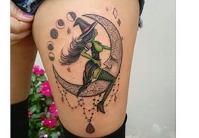 Green Ink Witch Sitting On Moon Tattoo On Left Thigh