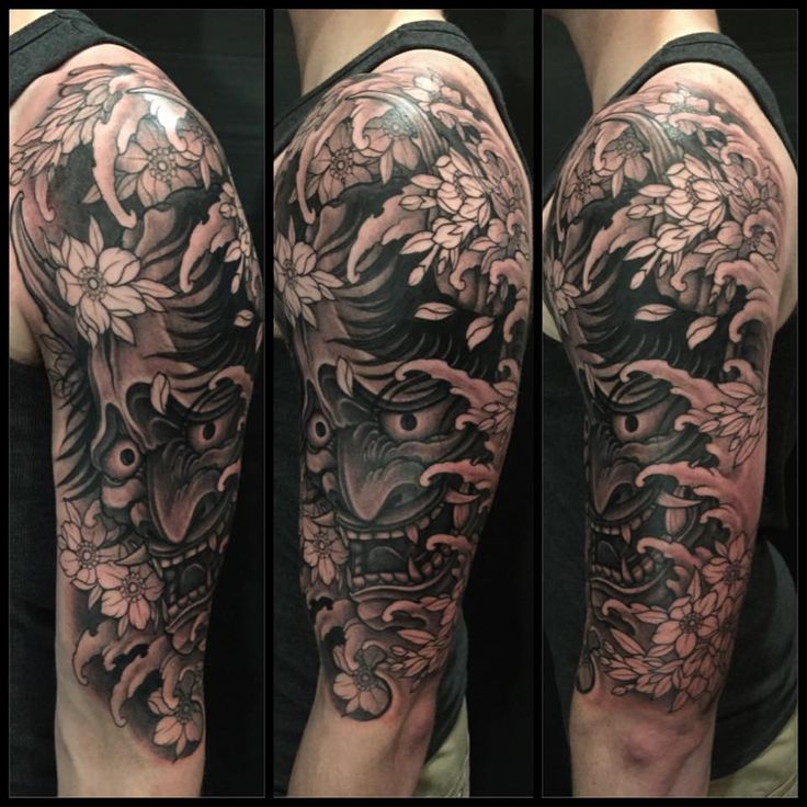 Grey Flowers And Hannya Tattoo On Left Half Sleeve