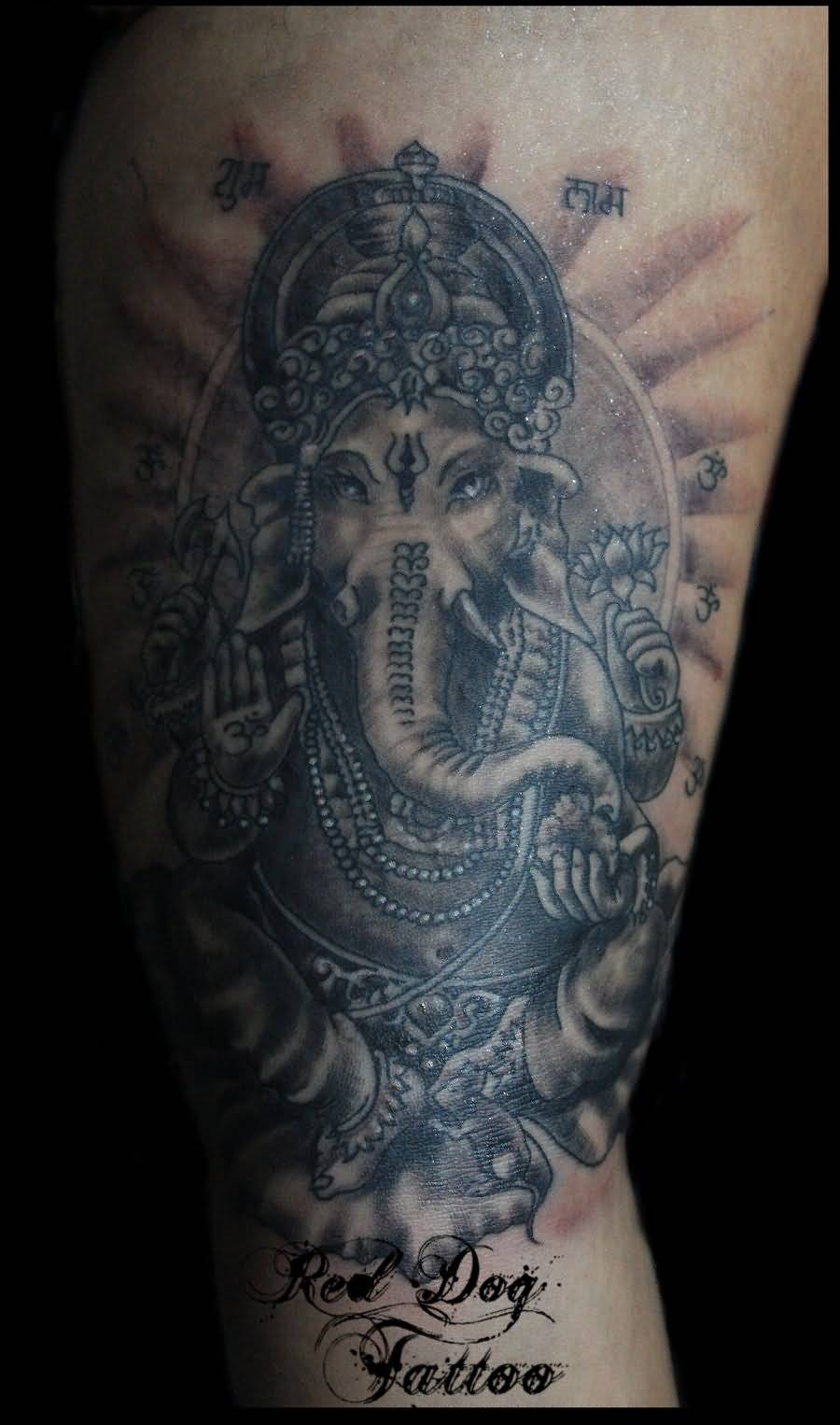 Grey Ink Ganesha Tattoo On Bicep by Red Dog Tattoo