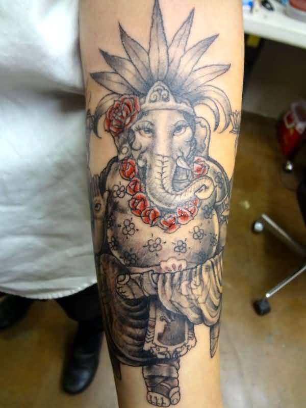 Grey Ink Ganesha Tattoo On Left Forearm