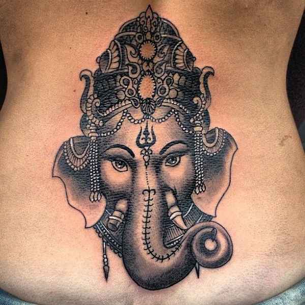 Grey Ink Ganesha Tattoo On Lower Back
