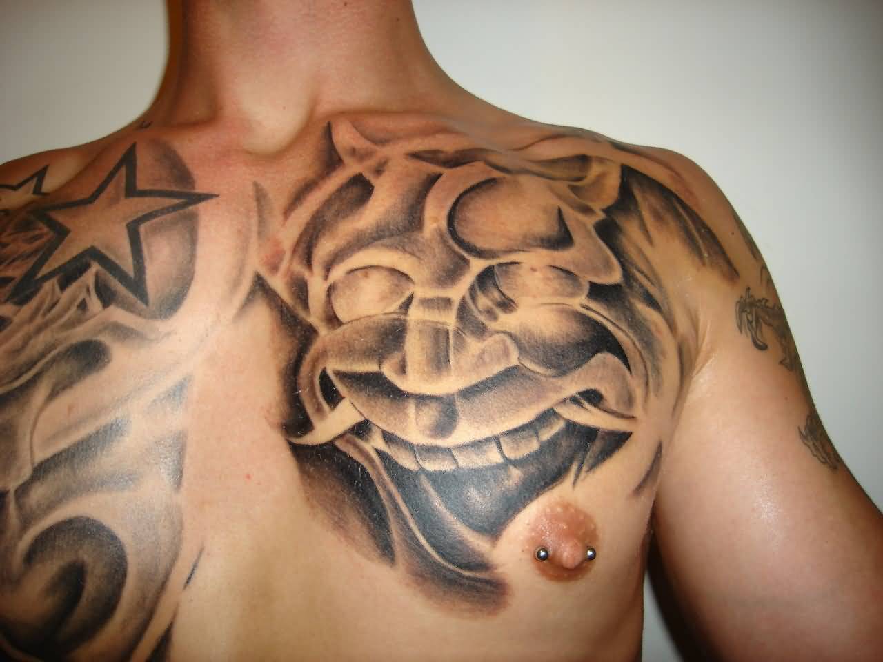Grey Ink Hannya Tattoo On Front Shoulder by Corneliustattoo