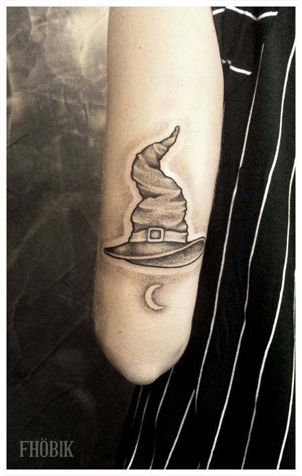 Grey Ink Witch Hat Tattoo On Right Arm