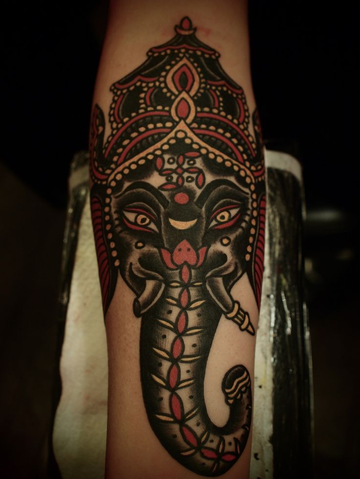 Hindu God Black Ink Ganesha Head Tattoo On Arm