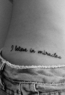 I Believe In Miracles Words Tattoo On Right Hip
