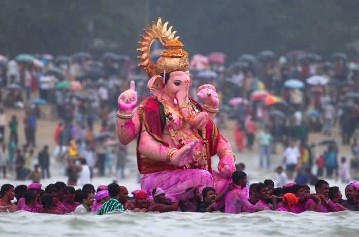 Lord Ganesha Idol In Immersion Process During The Celebration Of Ganesh Chaturthi