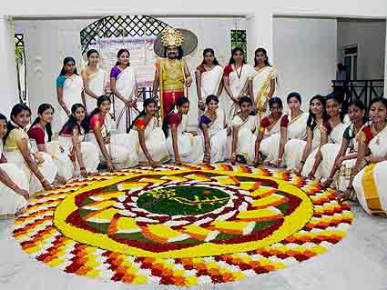 Malyali Girls Decorating Beautiful Flower Rangoli Picture For Onam