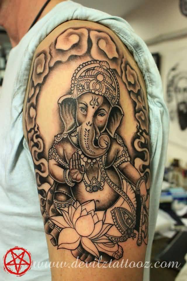 Nice Grey Ink Ganesha On Lotus Tattoo On Left Shoulder
