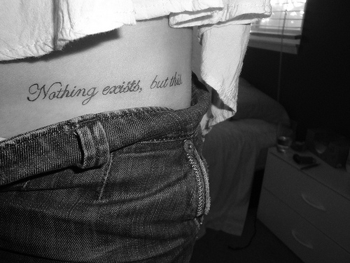 Nothing Exists But This Words Tattoo On Right Hip