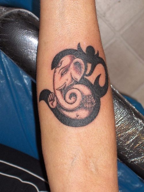 Om Ganesha Symbol Tattoo On Forearm