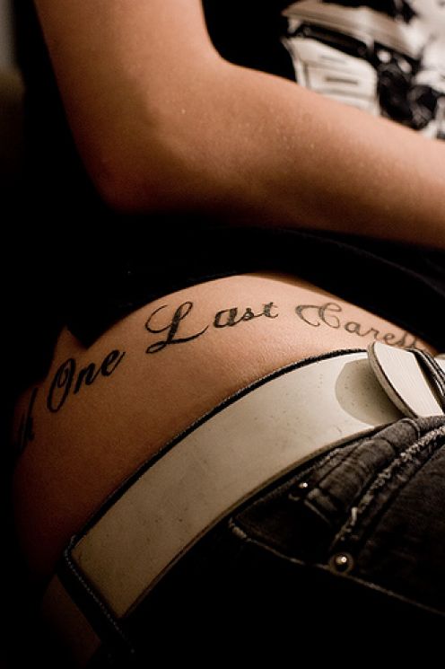 One Last Caress Word Tattoo On Girl Right Hip