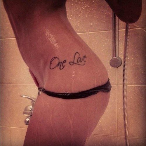 One Love Words Tattoo On Girl Left Hip