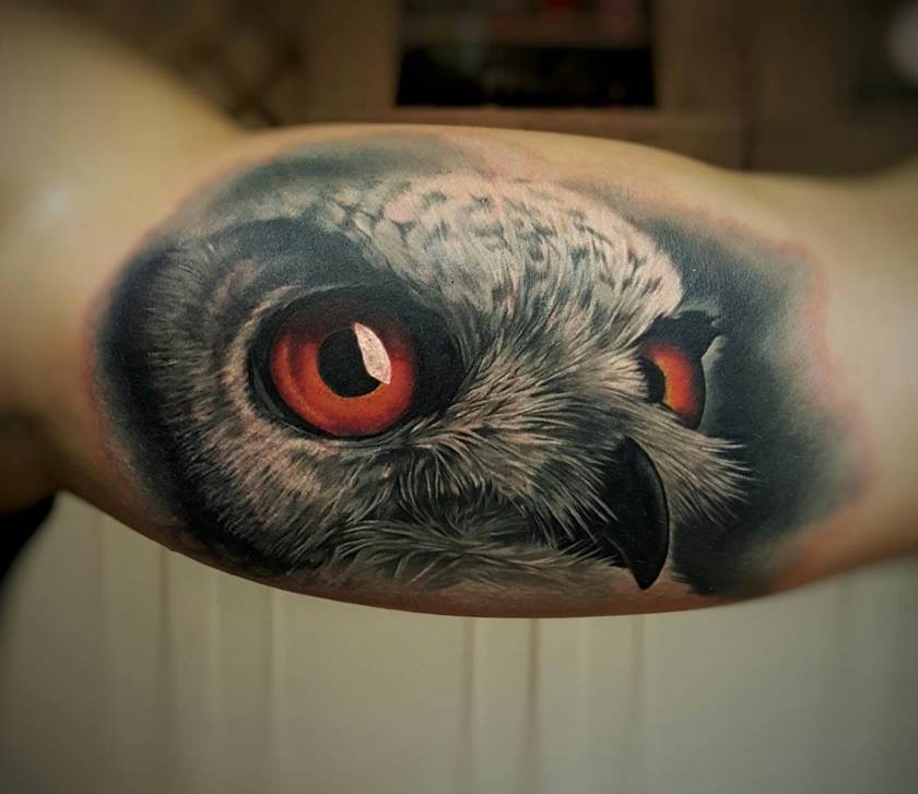 Owl Face Tattoo On Bicep by Casper Tattoos
