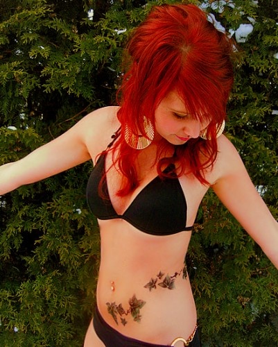 Poison Ivy Plant Tattoo On Girl Stomach
