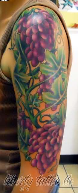 Purple Grapes Tattoo On Girl Left Half Sleeve