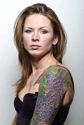 Purple Grapes Tattoo On Women Left Half Sleeve