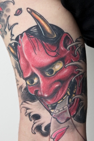 Red Ink Hannya Mask Tattoo On Right Bicep