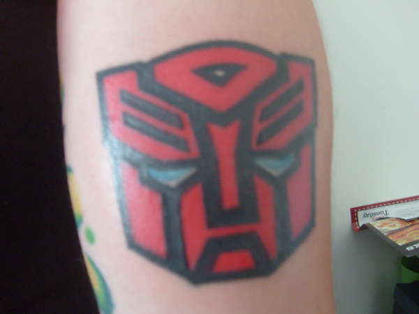 Red Transformer Symbol Tattoo Design For Sleeve