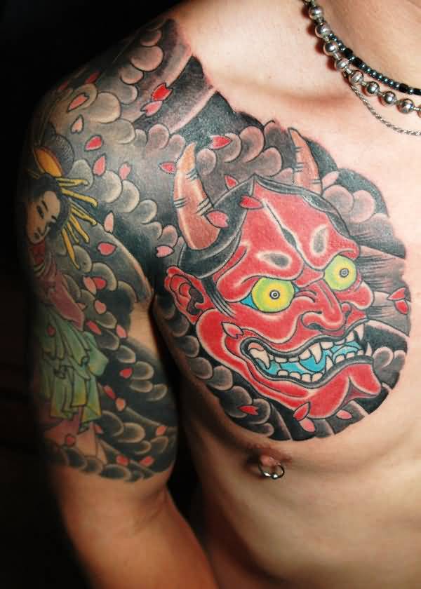 Red ink Japanese Hannya Mask Tattoo On Man Chest And Shoulder