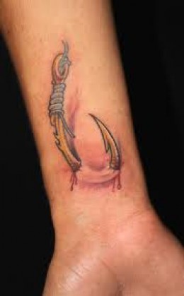 Ripped Skin Hook Tattoo On Wrist