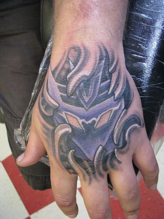 Ripped Skin Transformer Logo Tattoo On Hand