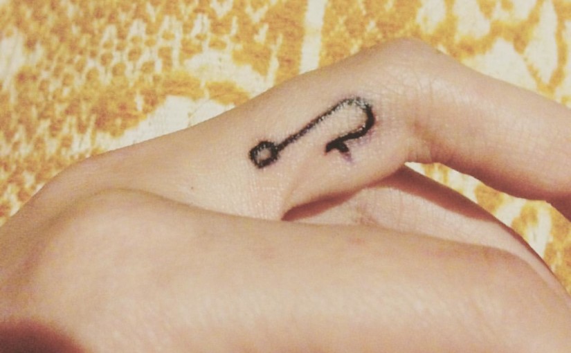 Simple Black Hook Tattoo On Finger