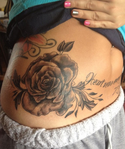 Simple Black Ink Rose Tattoo On Girl Right Hip