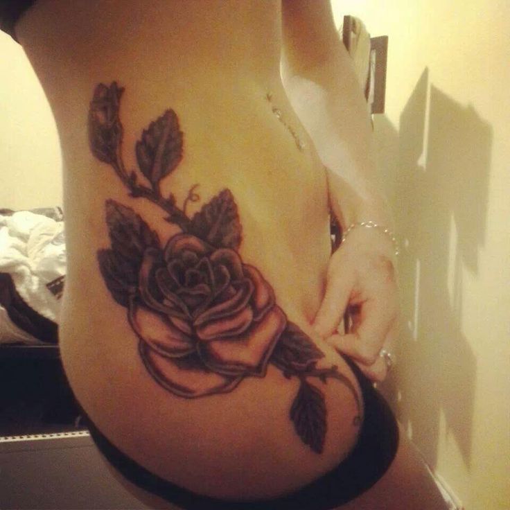 Simple Black Ink Roses Tattoo On Girl Right Hip