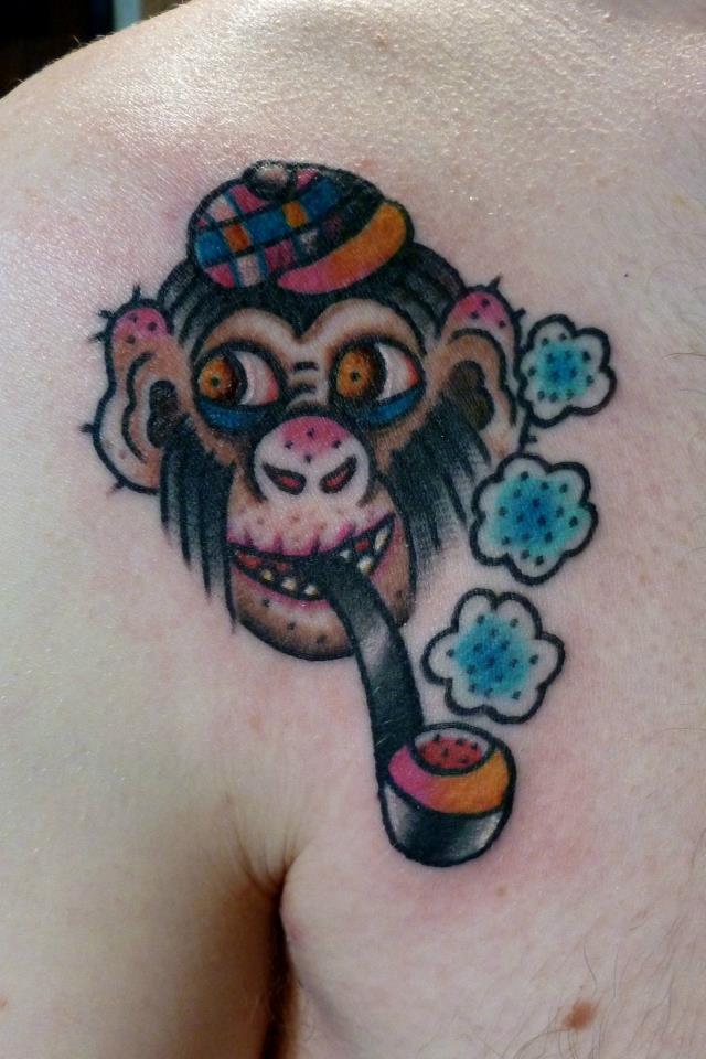 Traditional Monkey Smoking Tobacco Pipe Tattoo On Right Front Shoulder