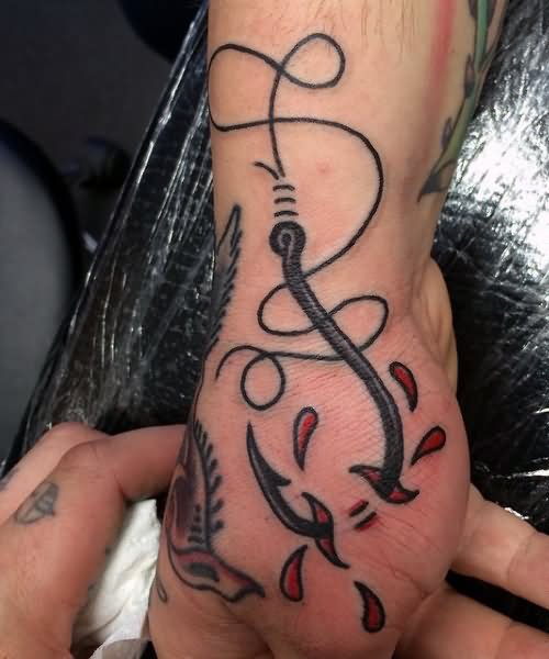Traditional Ripped Skin Hook Tattoo On Hand