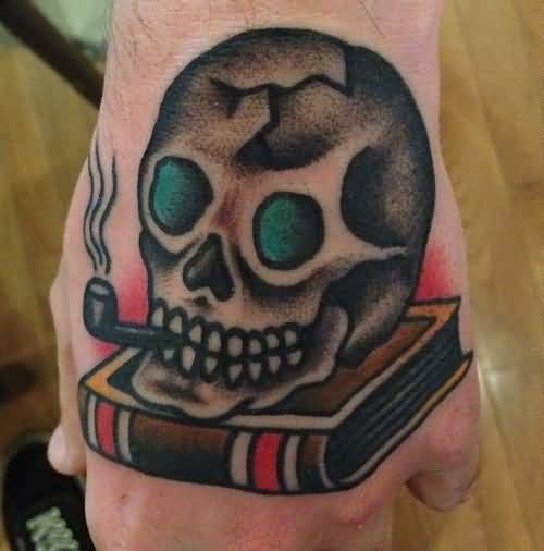 Traditional Skull Smoking Tobacco Pipe With Book Tattoo On Hand