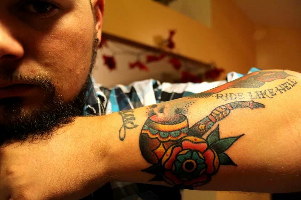 Traditional Tobacco Pipe With Flower Tattoo On Man  Arm