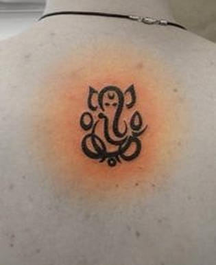 Tribal Outline Ganesha Tattoo On Upper Back