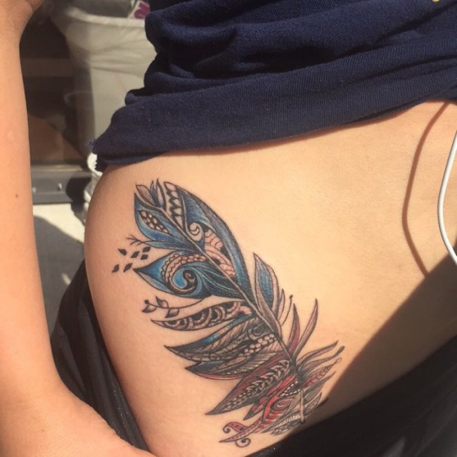 Unique Feather Tattoo On Girl Hip